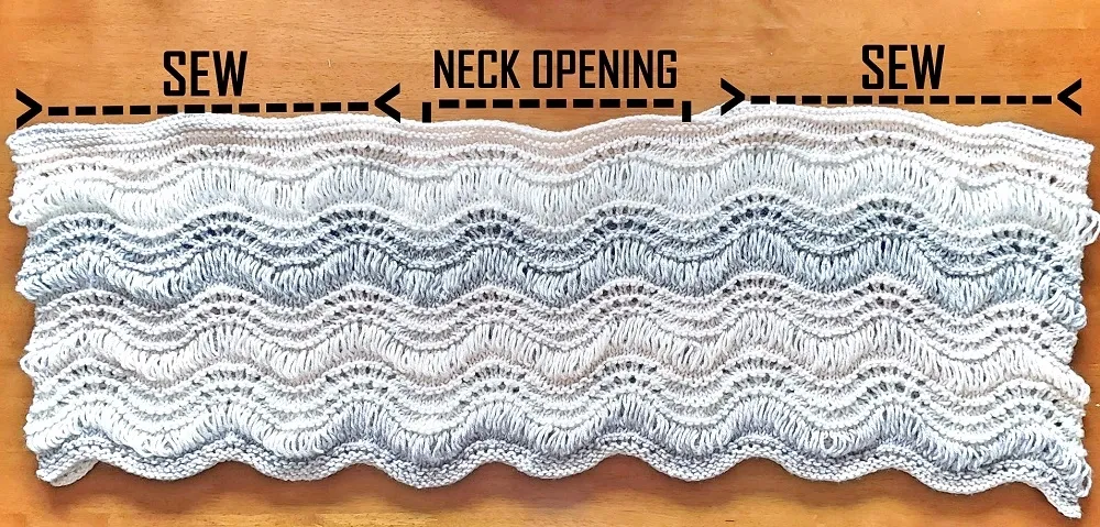 The Angelic Sweater Poncho laid flat on the floor to show how to sew the shoulder seams.