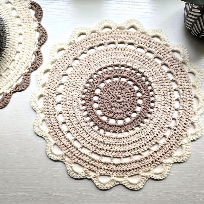 A free pattern for the Bohemian Doily Crochet Placemat shown in a neutral ombre yarn.