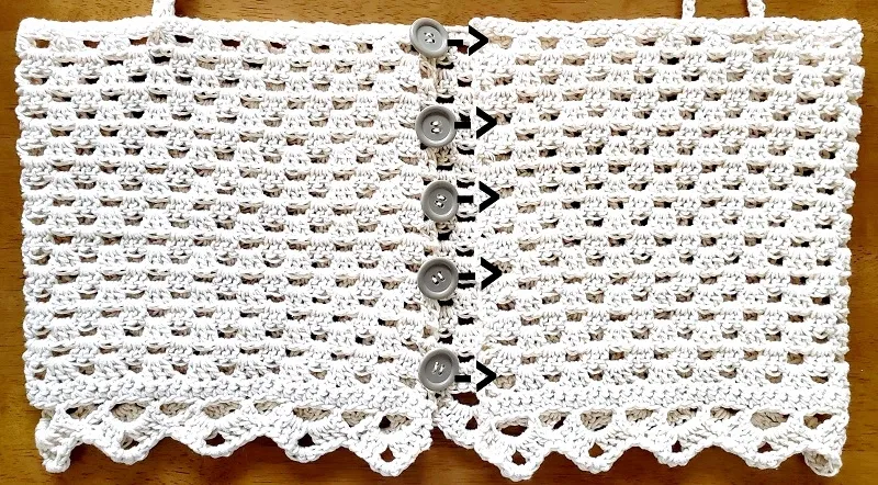 How to sew the buttons on the crochet top.