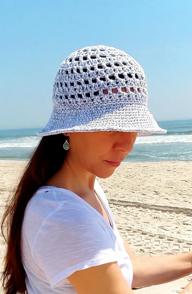 Close up view of the crochet sun hat to show the open mesh pattern. 