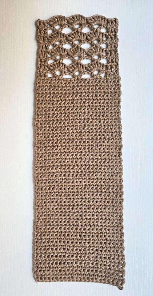 How the crochet crossbody bag is constructed in one long piece.