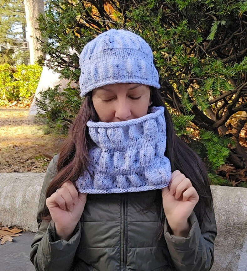 A front view of the Pucker Pop Cowl and Hat knitted set.