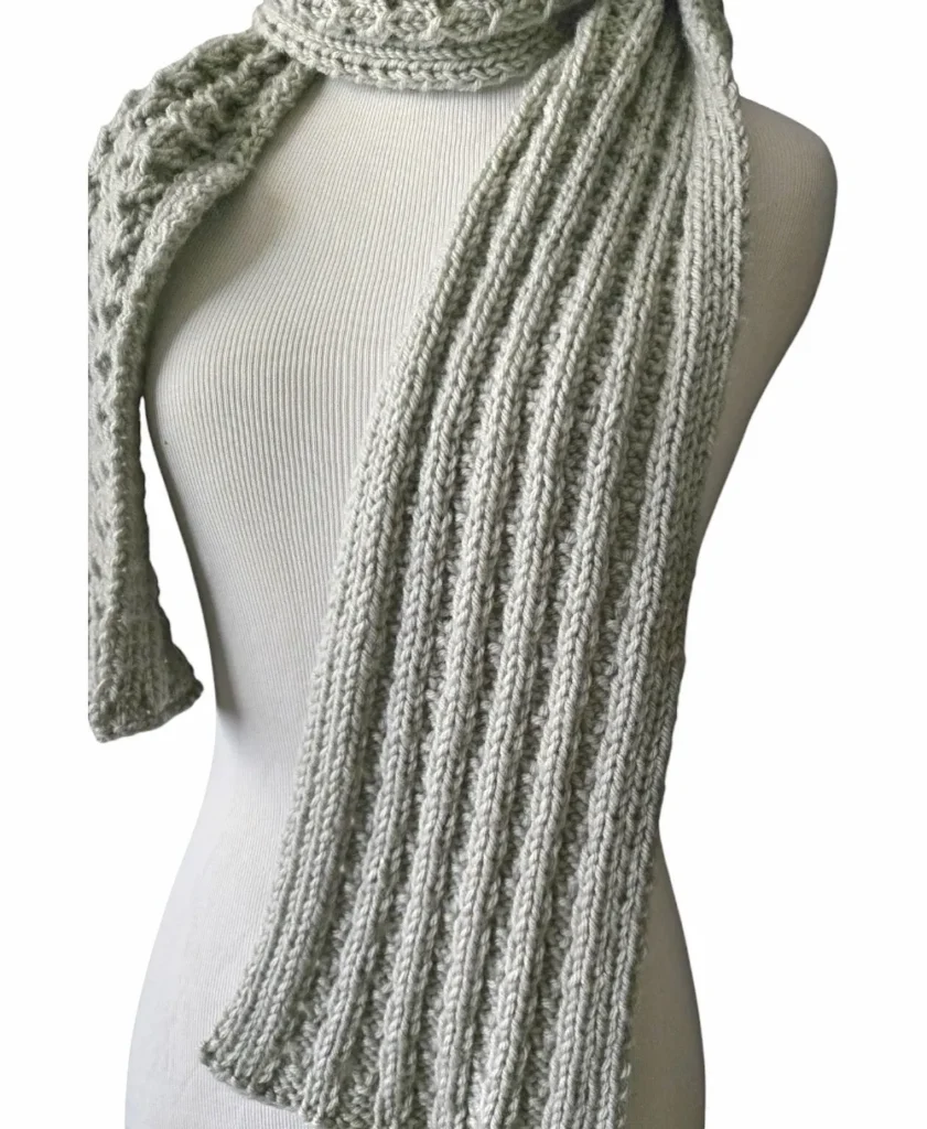 The wrong side of the knit scarf showing it is reversible. 